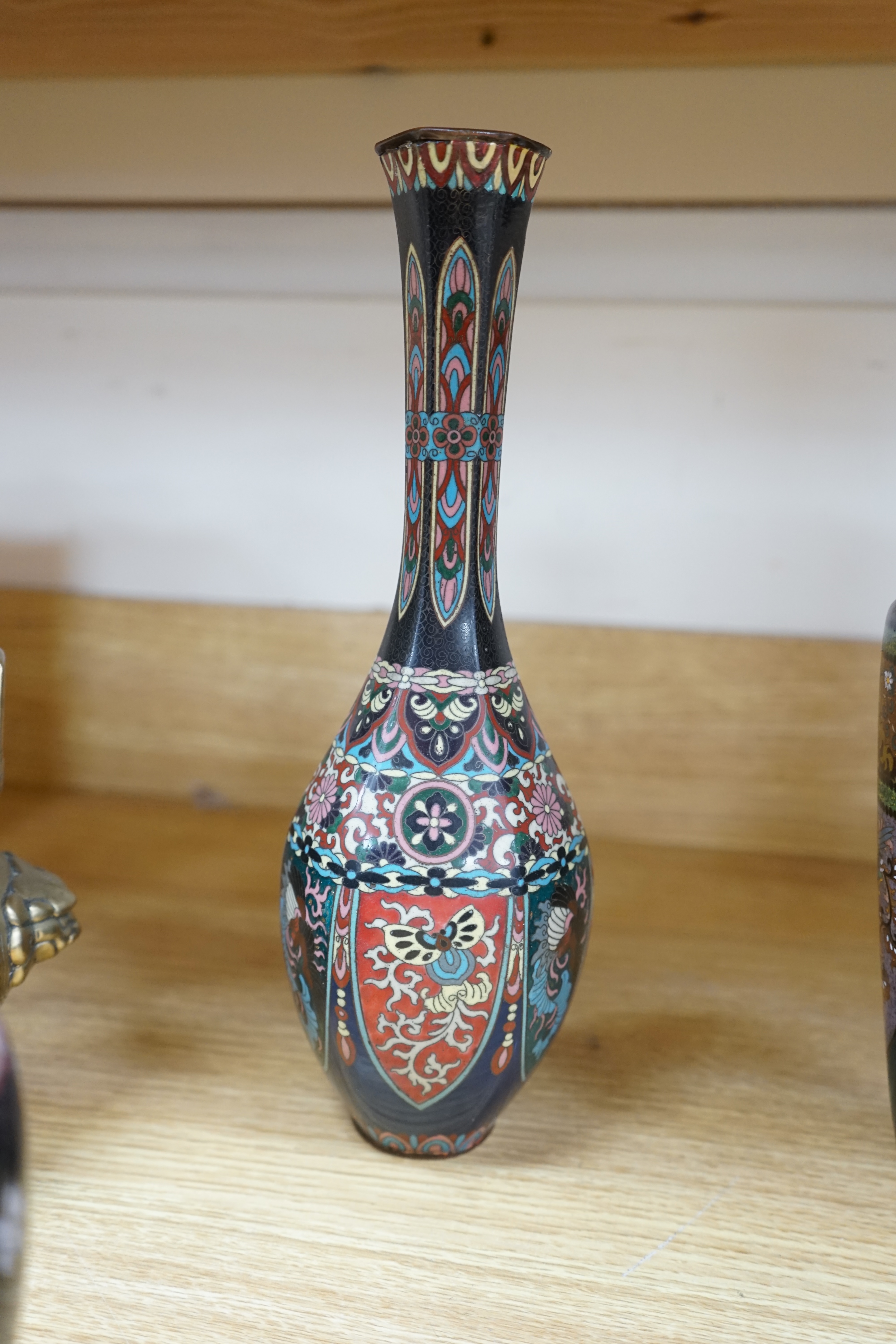 A large collection of Chinese and Japanese cloisonné vases and a brass twin handled censer, largest 31cm high. Condition - mostly poor to fair